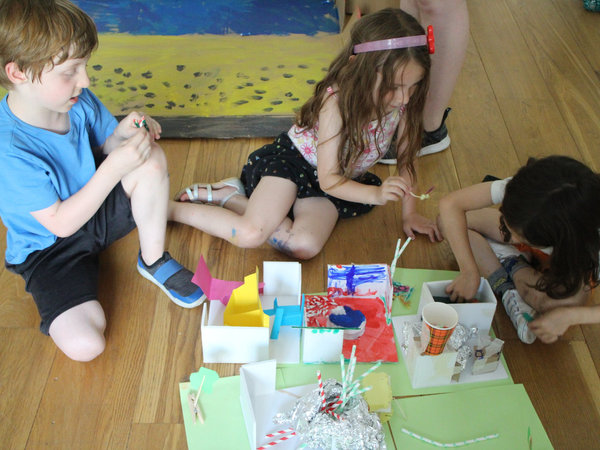 children working on a model, team-work