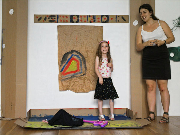 a child on a self-made stage performing