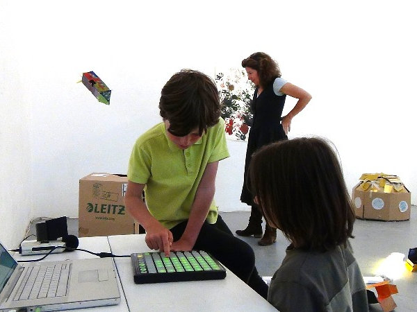 boys playing with a DJ console